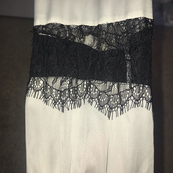 Ivory Silky Blouse with black lace sleeve. - Picture 2 of 4